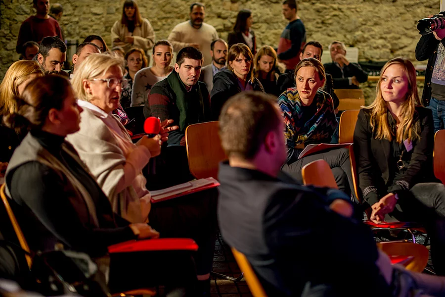 This image shows a panel discussion or conference organised by the Friedrich-Ebert-Stiftung in Kosovo, focusing on active civil society and political issues.